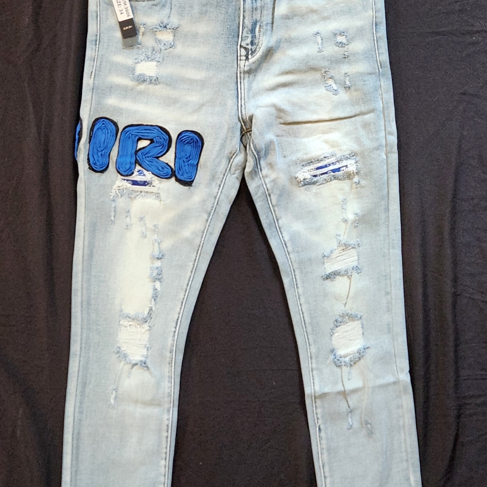 Men's Amiri Light Blue Distressed Jeans With With Blue Amiri Design Brand New
